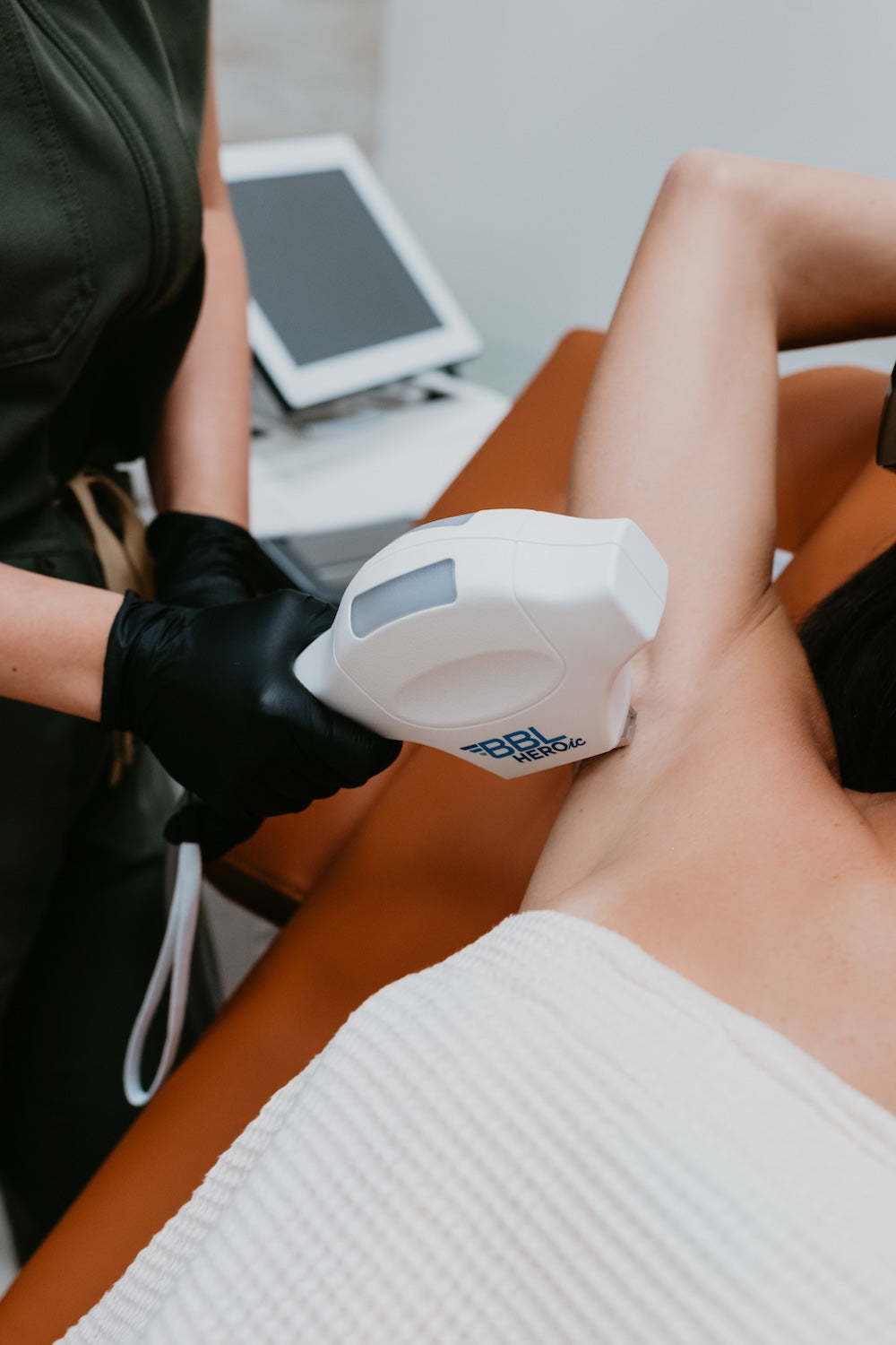 Medical professional preparing a syringe in a modern treatment room